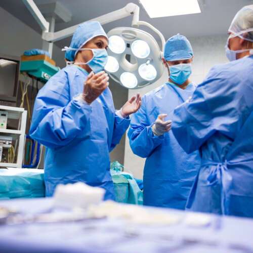 surgeons interacting with each other operation room