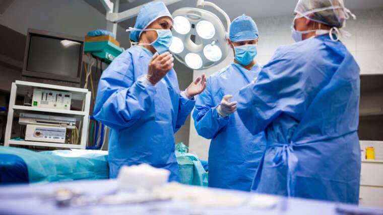 surgeons interacting with each other operation room